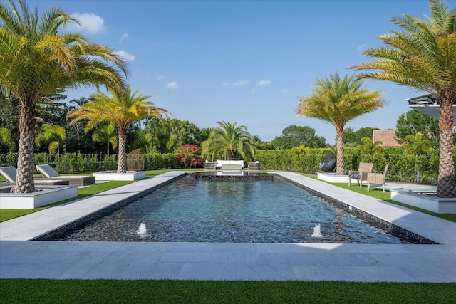 view of pool with pool water feature