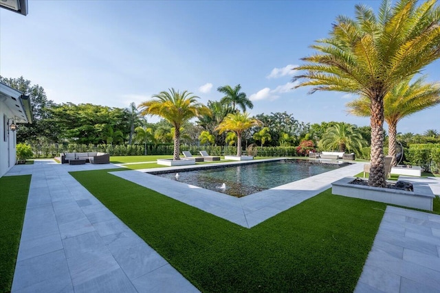 view of swimming pool with a yard, an outdoor hangout area, and a patio