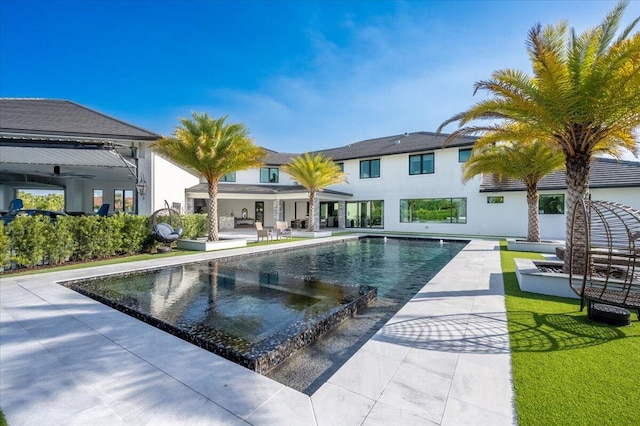 view of pool featuring a patio area and ceiling fan