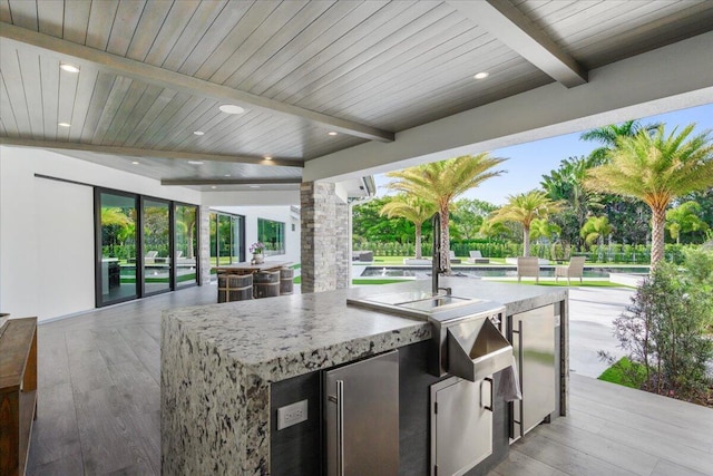 view of patio featuring exterior kitchen