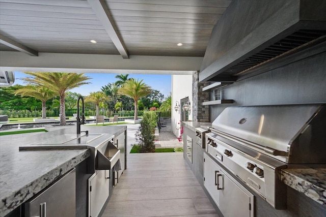 view of patio featuring a grill and exterior kitchen