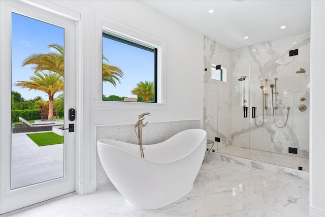 bathroom featuring tile flooring and separate shower and tub