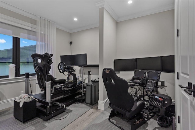 office with light hardwood / wood-style flooring and crown molding