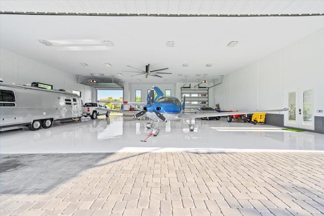 garage featuring french doors and ceiling fan