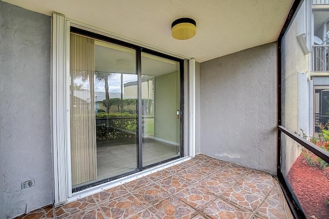 unfurnished sunroom featuring a healthy amount of sunlight