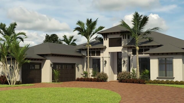 view of front facade with a front yard and a garage