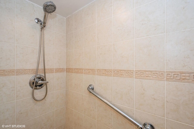 bathroom with a tile shower