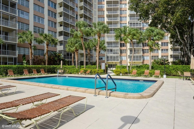 view of swimming pool featuring a patio