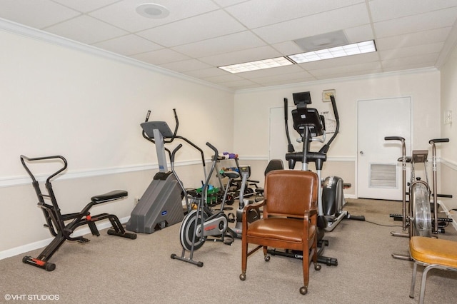 exercise room with crown molding and a drop ceiling