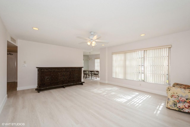 unfurnished room with light hardwood / wood-style flooring and ceiling fan