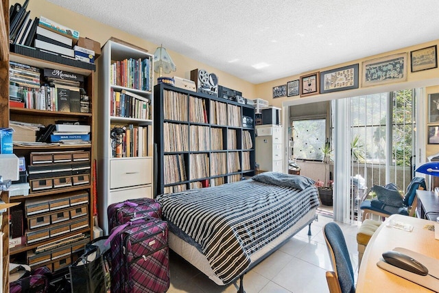 tiled bedroom with a textured ceiling