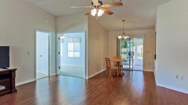 unfurnished room featuring dark wood-type flooring, high vaulted ceiling, and ceiling fan with notable chandelier