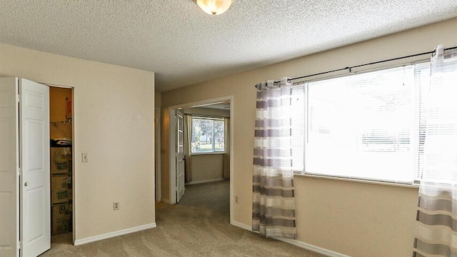 carpeted bedroom with a textured ceiling