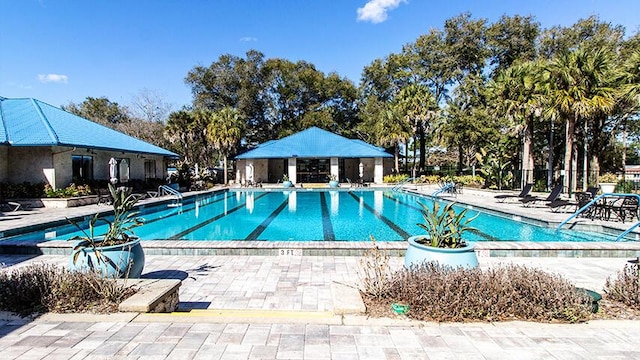 view of swimming pool with a patio