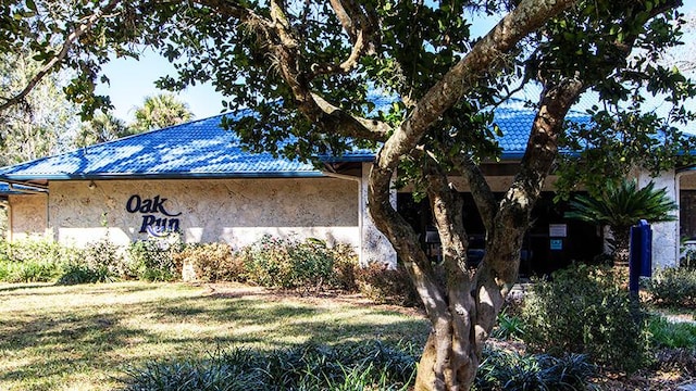 view of property exterior with a lawn