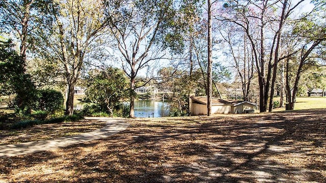 view of front of house with a water view