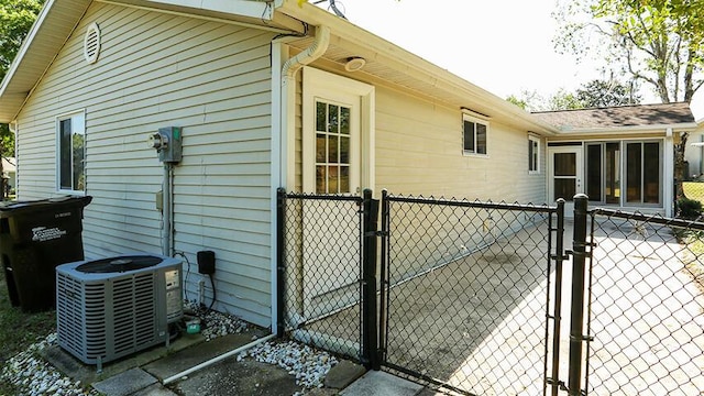 view of side of property with central AC