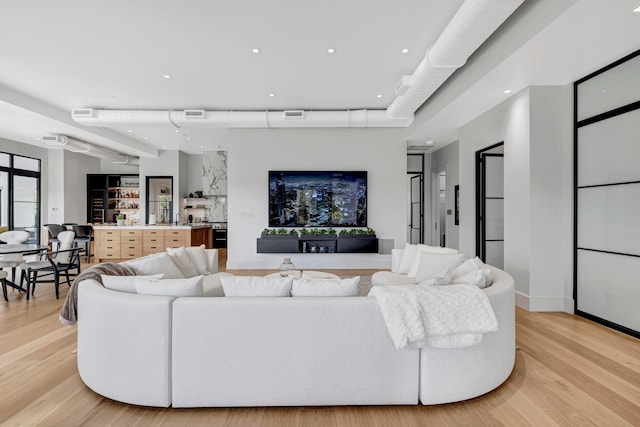 living room with light hardwood / wood-style floors