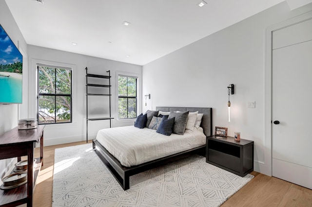 bedroom with light hardwood / wood-style floors