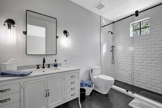 bathroom with toilet, walk in shower, and vanity