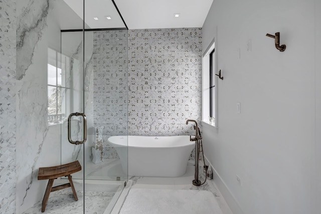 bathroom featuring plenty of natural light, walk in shower, tile walls, and tile flooring