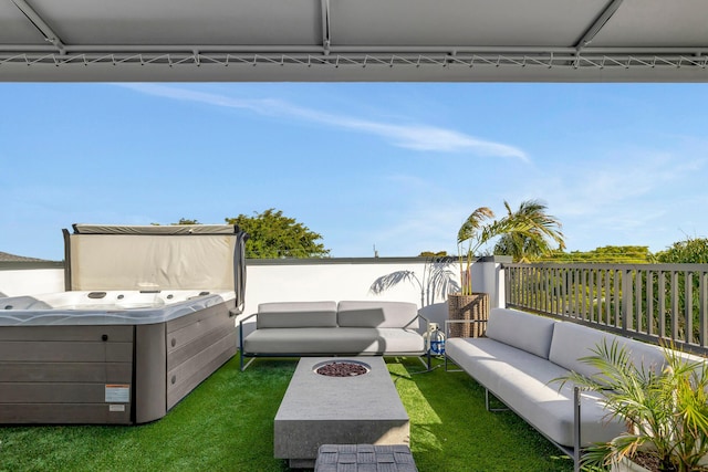 view of yard featuring outdoor lounge area and a hot tub