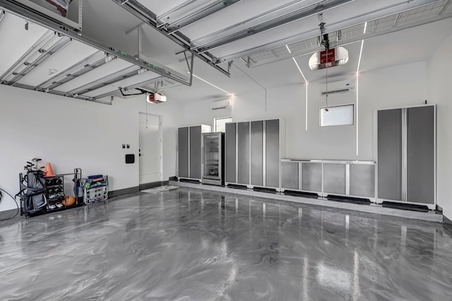 garage with a wall mounted AC and a garage door opener