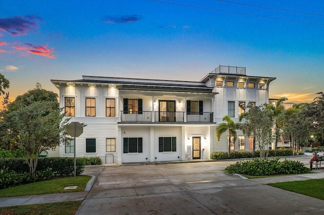 view of front of house featuring a balcony