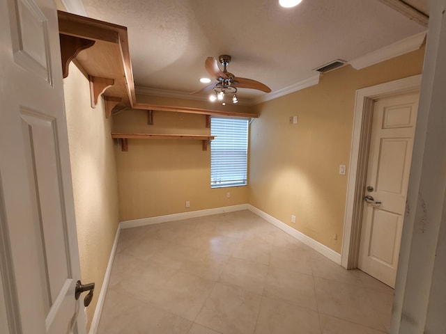 unfurnished room with light tile flooring, ornamental molding, and ceiling fan