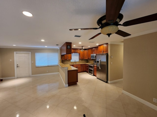 kitchen with light tile floors, backsplash, ceiling fan, and stainless steel appliances