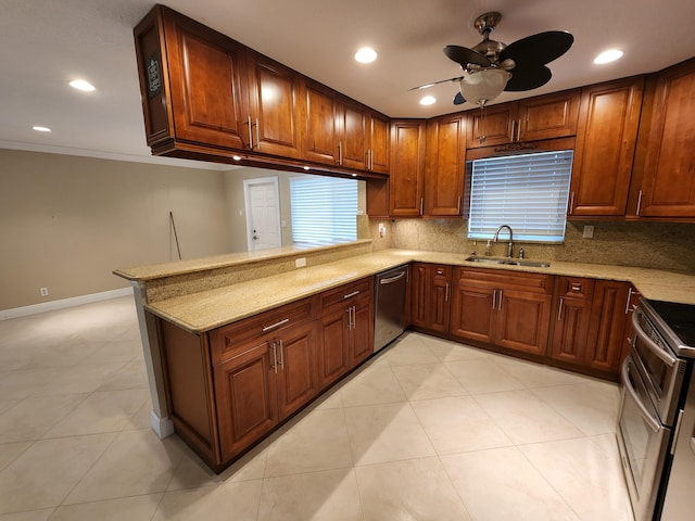 kitchen featuring kitchen peninsula, ceiling fan, crown molding, stainless steel appliances, and tasteful backsplash