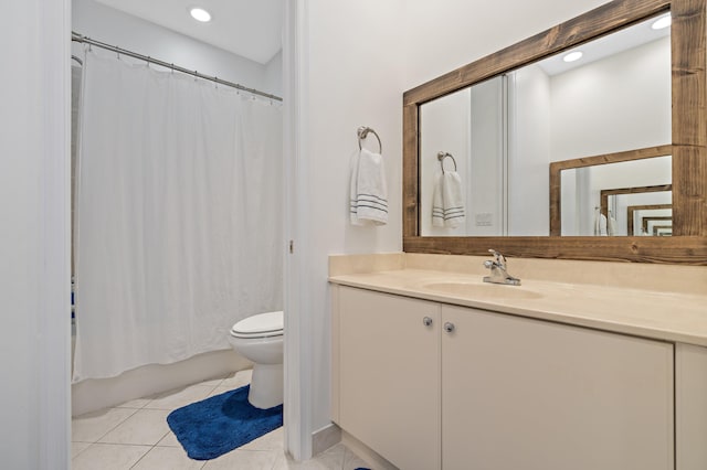 full bathroom with toilet, tile floors, large vanity, and shower / bath combo with shower curtain