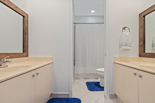 bathroom with vanity, tile floors, and toilet