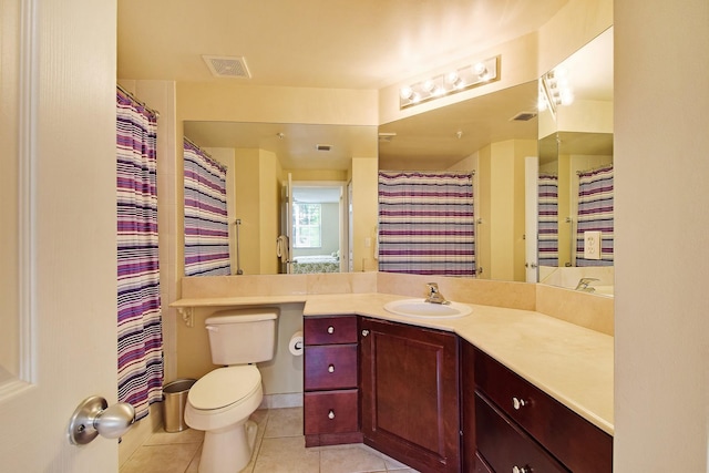 bathroom with vanity, tile flooring, and toilet