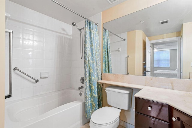 full bathroom with vanity, shower / bath combo with shower curtain, and toilet