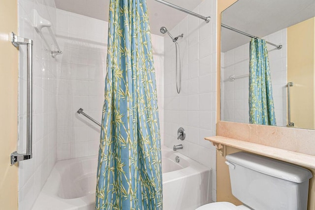 bathroom with shower / bath combo and toilet