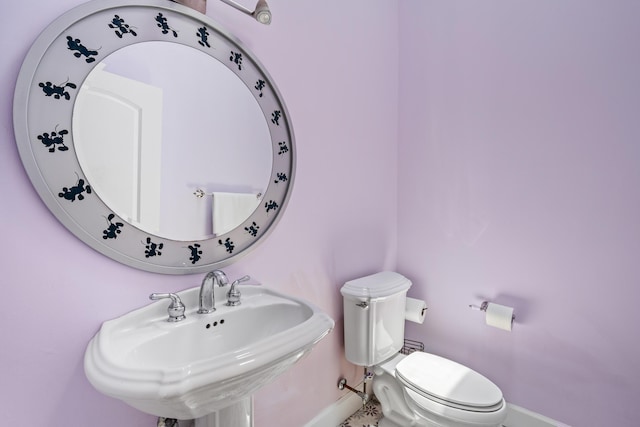 bathroom with toilet and sink