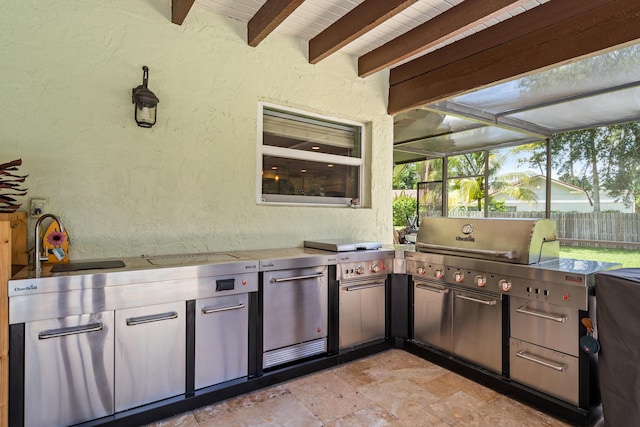 view of patio with exterior kitchen and sink