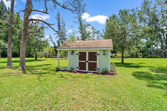 view of shed / structure featuring a yard