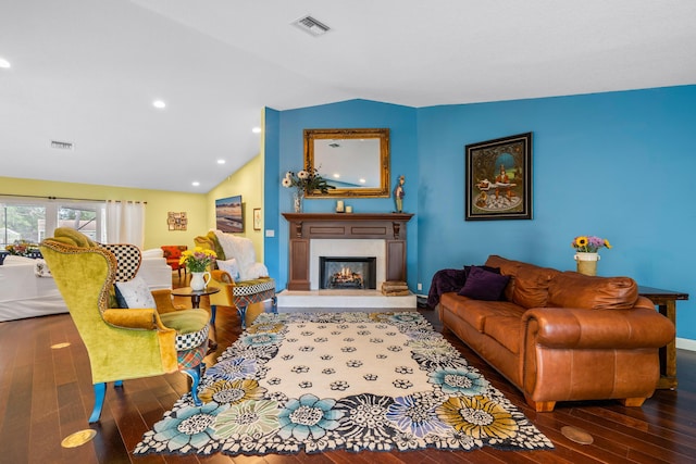 living room with dark wood-type flooring and lofted ceiling