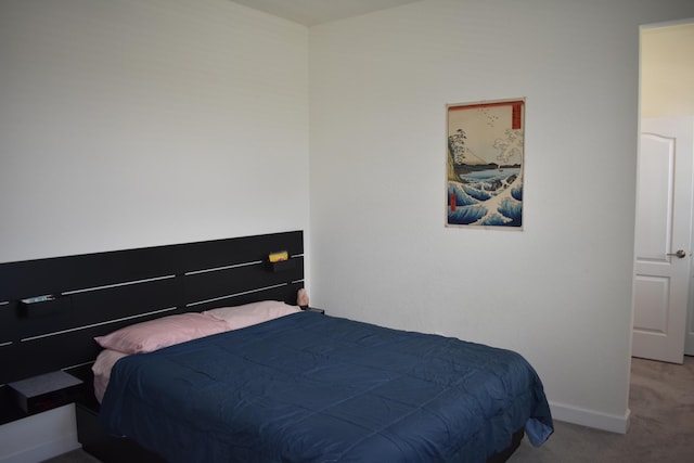 bedroom featuring light carpet