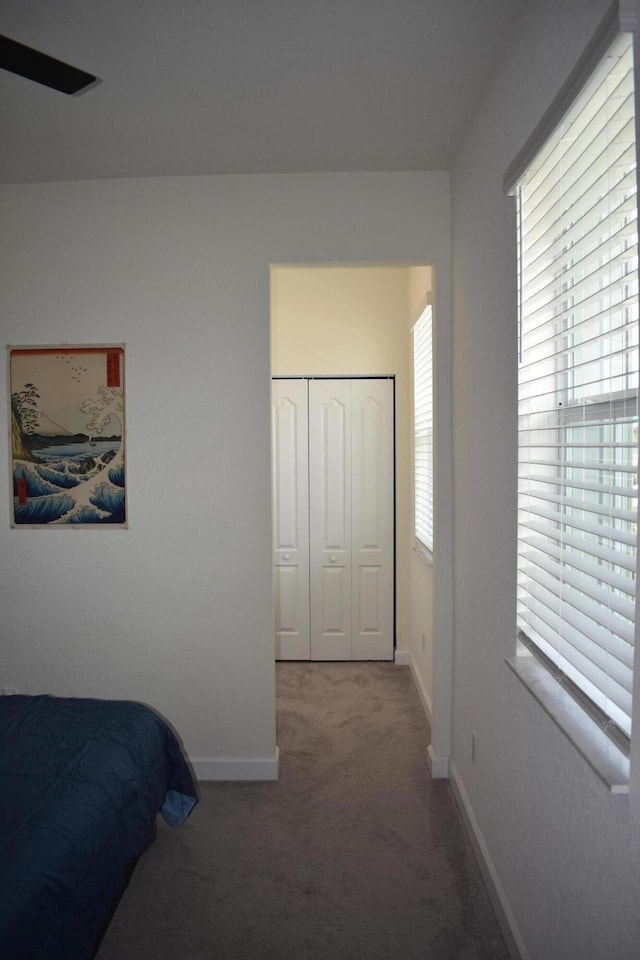 carpeted bedroom with a closet