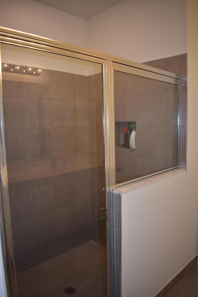 bathroom featuring an enclosed shower