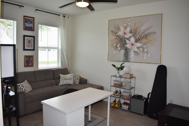 interior space with tile flooring and ceiling fan