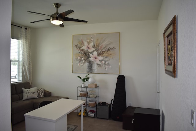 living room featuring ceiling fan and light tile floors