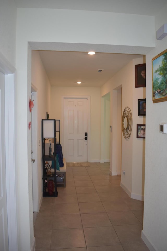 hallway with light tile floors