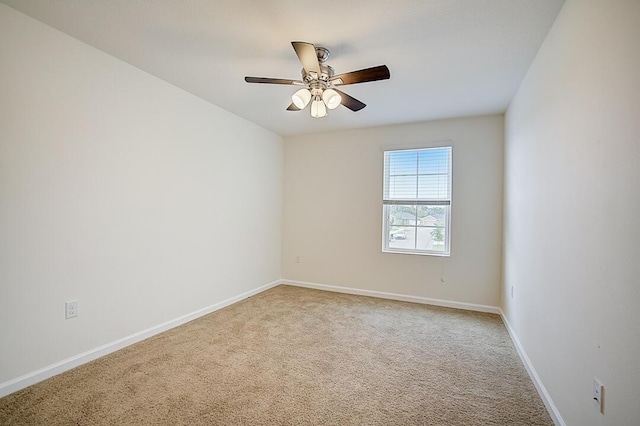 unfurnished room with light carpet and ceiling fan