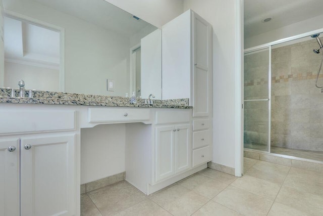 bathroom with tile floors, large vanity, walk in shower, and crown molding