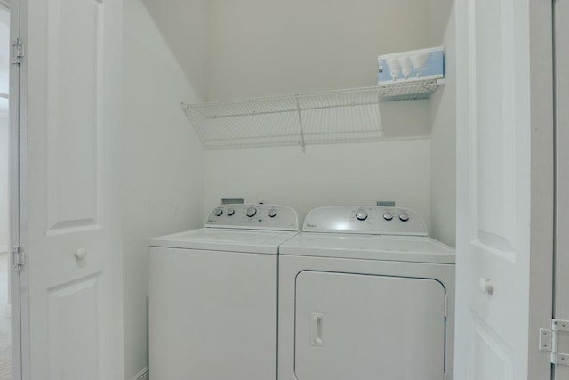 laundry area featuring washing machine and clothes dryer