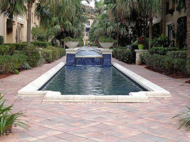 view of pool with a patio area and pool water feature